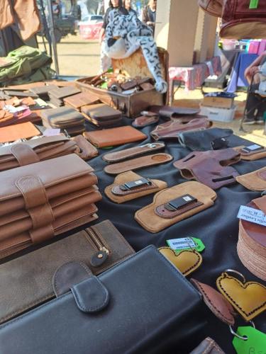 Leather products on a table, including book covers